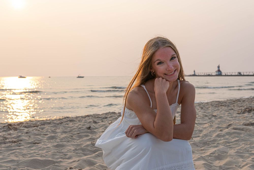 Sunset beach portraits with golden light reflecting on the sand.