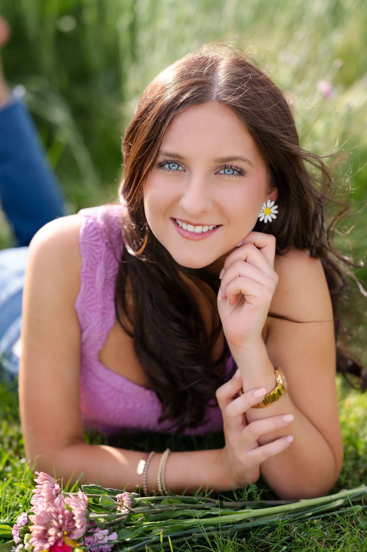 Close-up portrait in white dress against neutral background with warm natural lighting.