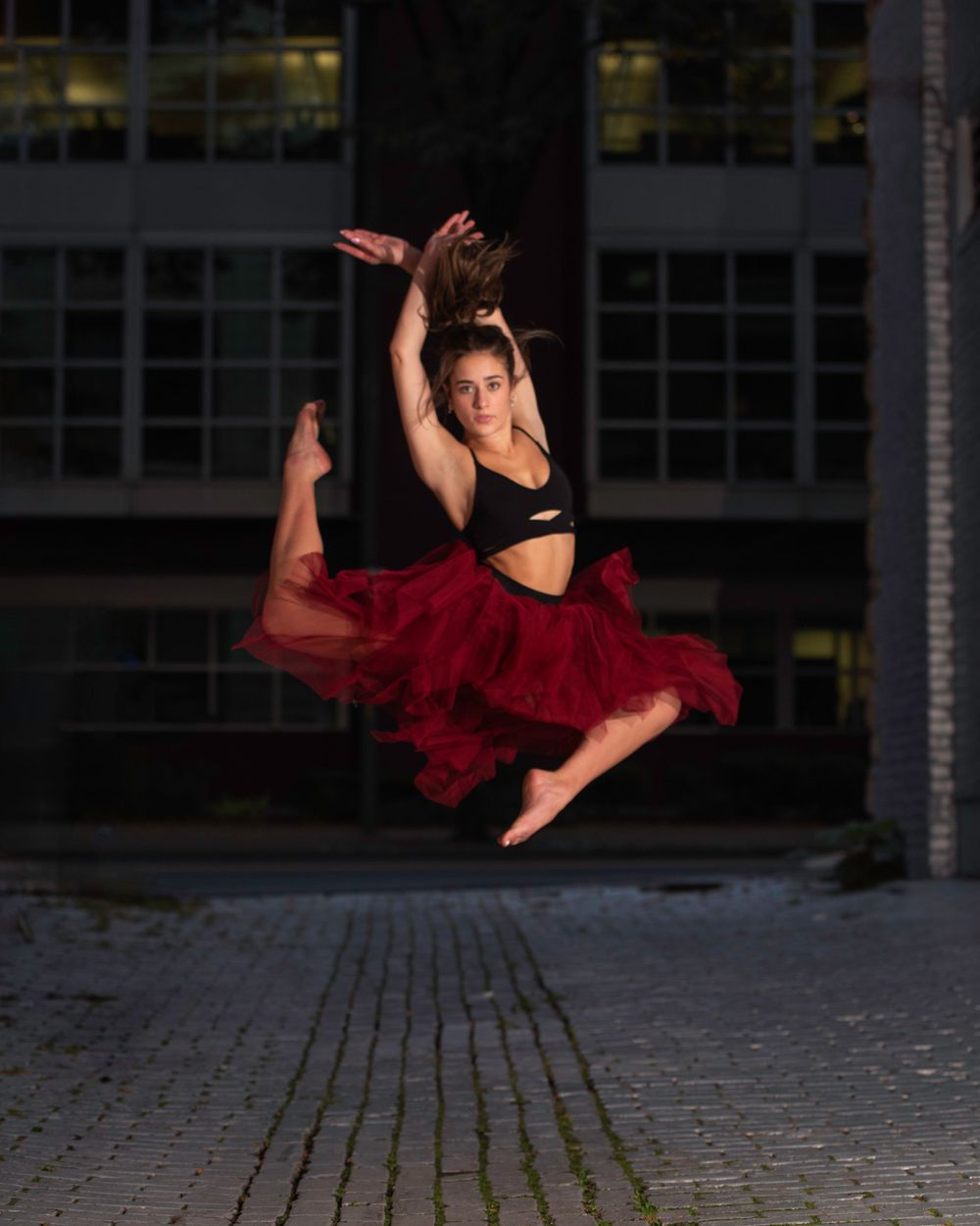 Dancer red skirt street photography night