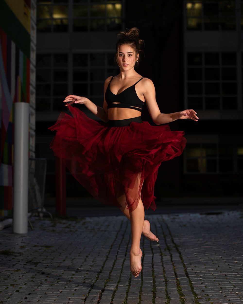 Dancer red skirt street photography night