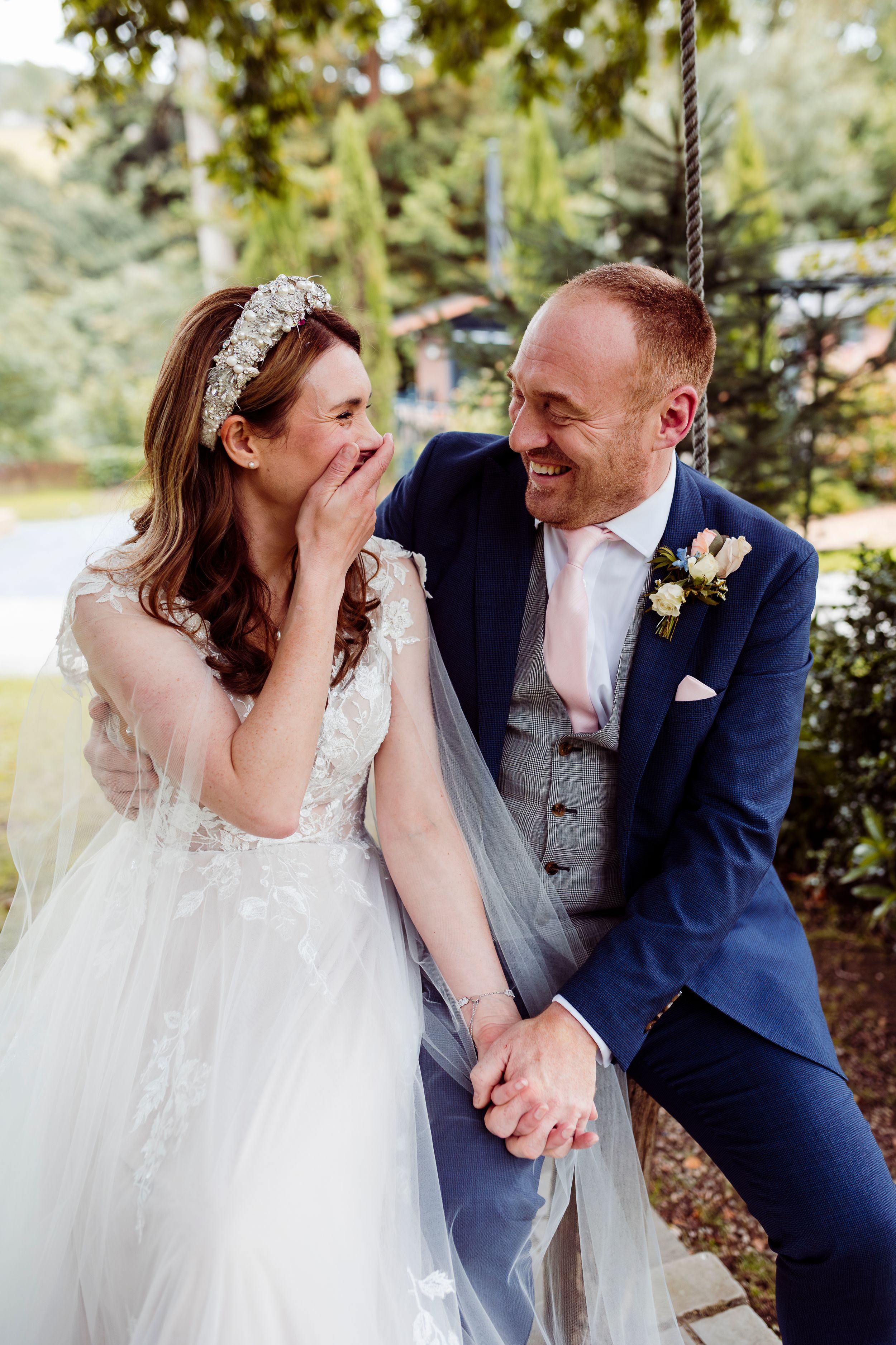 bride and groom laughing - broadoaks country house, Cumbria
