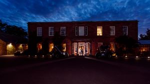 Nighttime, flash wedding photography - bride and groom in front of hotel