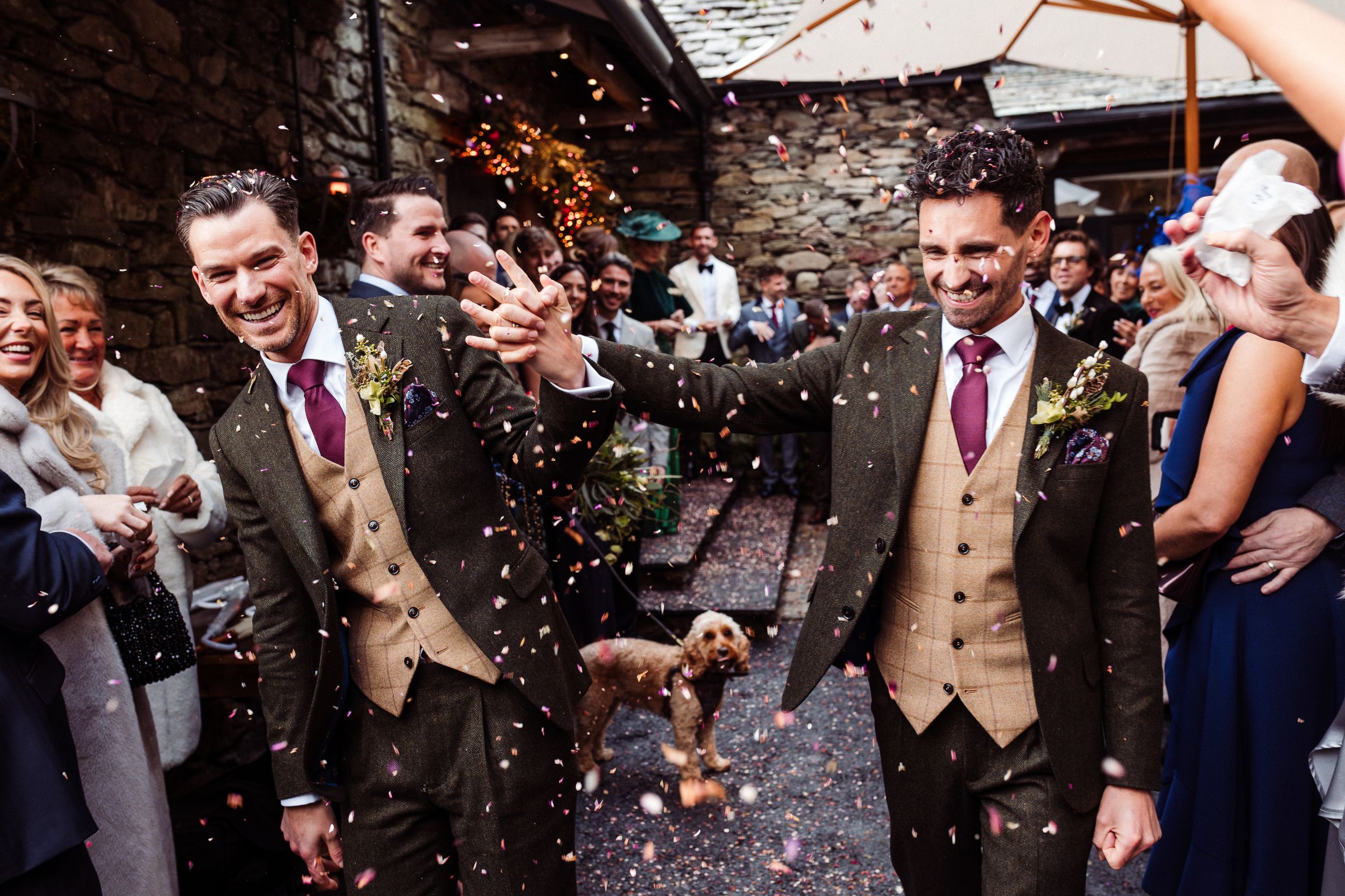 Mark and Dan get married at Lancrigg Hotel - this photo shows them showered in confetti and laughing
