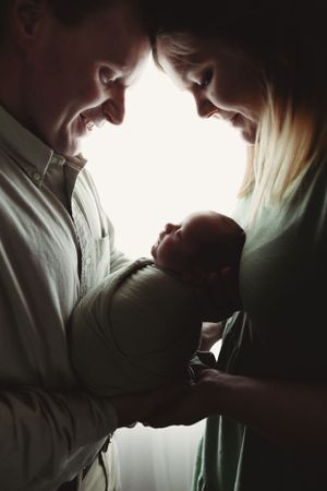 Intimate black and white silhouette photo sequence showing tender moments between two figures.