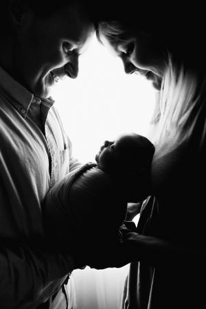 Series of silhouetted figures in dramatic lighting creating an emotional atmosphere.