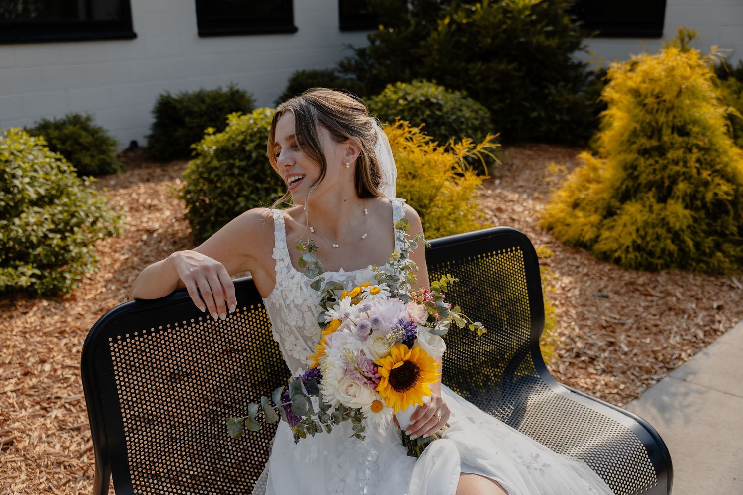 Elegant bridal shoes and floral accessories arranged on white background in West Bend, WI  with Essence Rose Photography.
