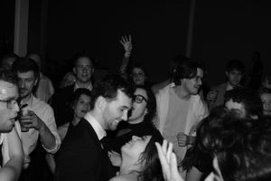 Last dance between a bride and groom with the wedding guests circled around them
