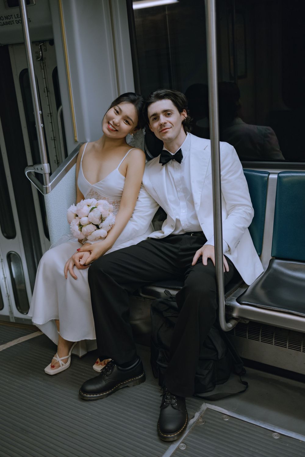 Candid moments of newlyweds sitting together on subway train seats.