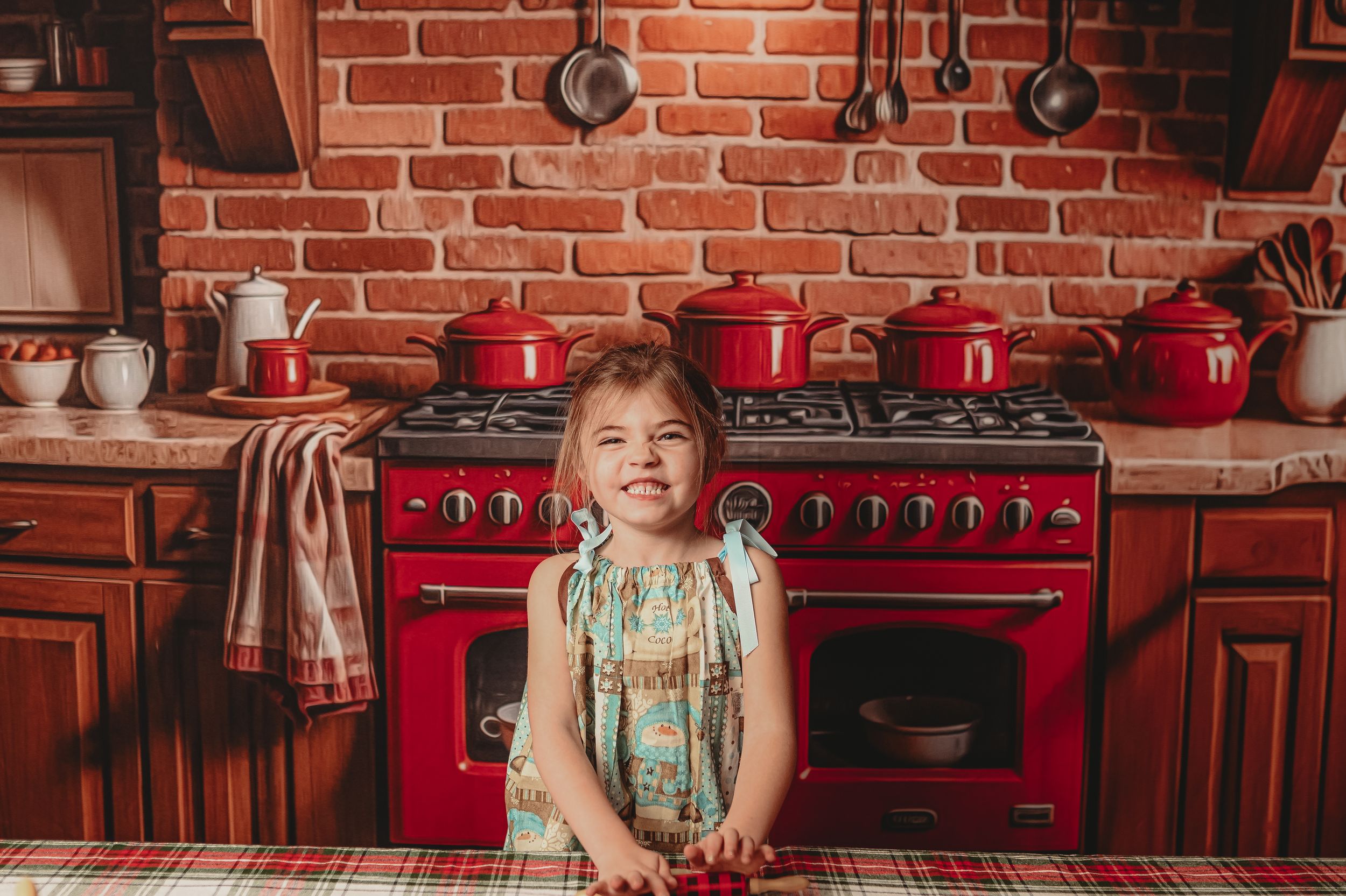 Rustic kitchen interior with exposed brick walls and red appliances in vintage style.