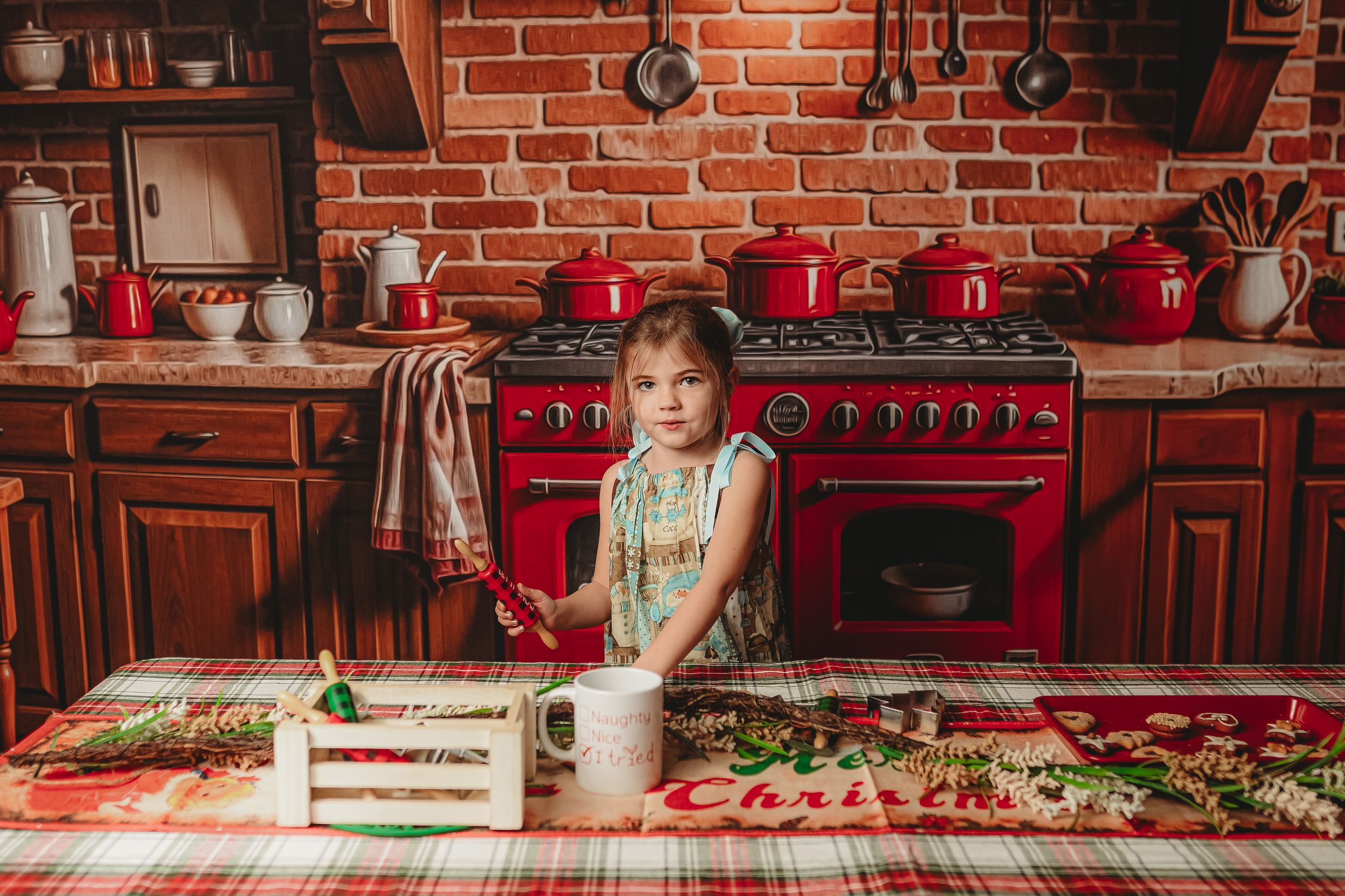 Vintage-style kitchen with red brick walls and festive holiday decorations on display.