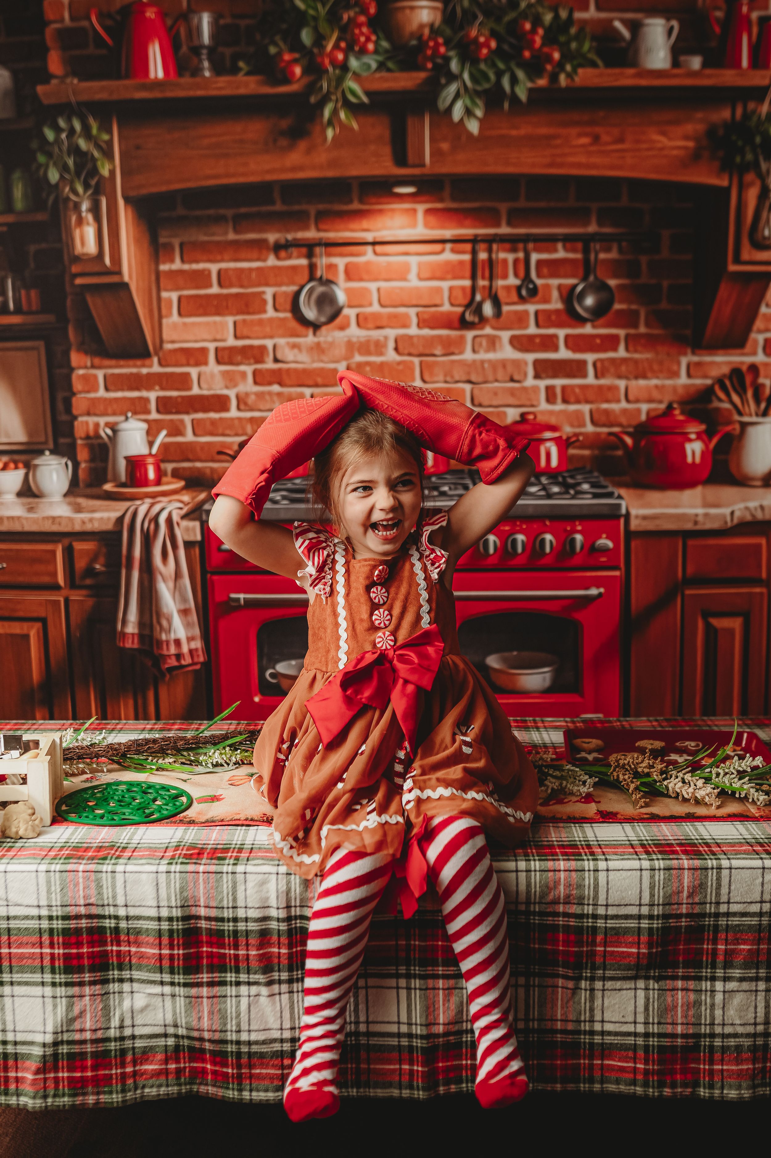 Joyful holiday moment in a rustic kitchen with red appliances and festive decorations.