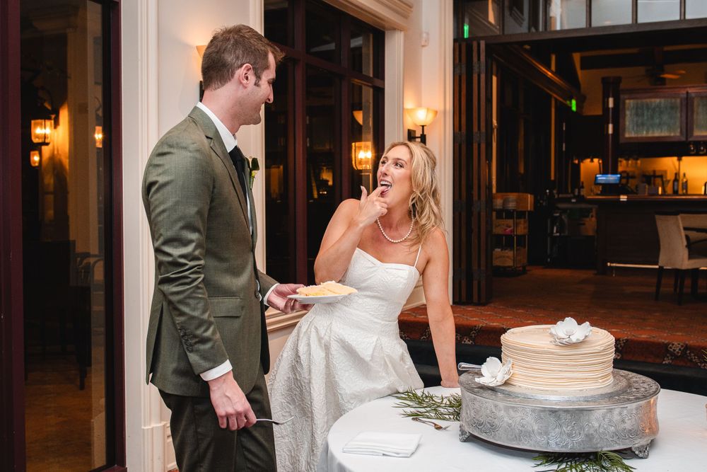 bride and groom cutting the cake