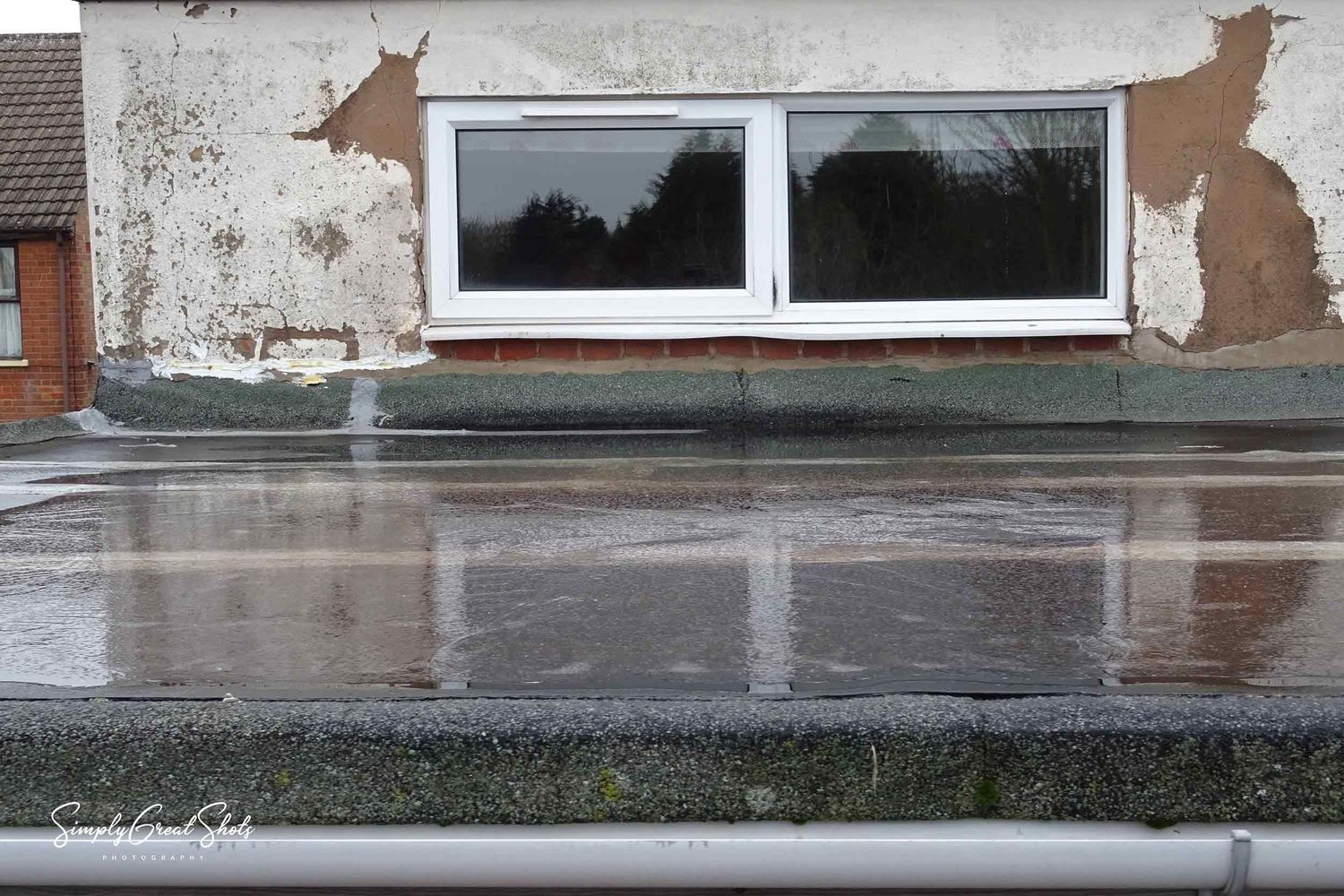 A flat roof inspection carried out using a camera mast