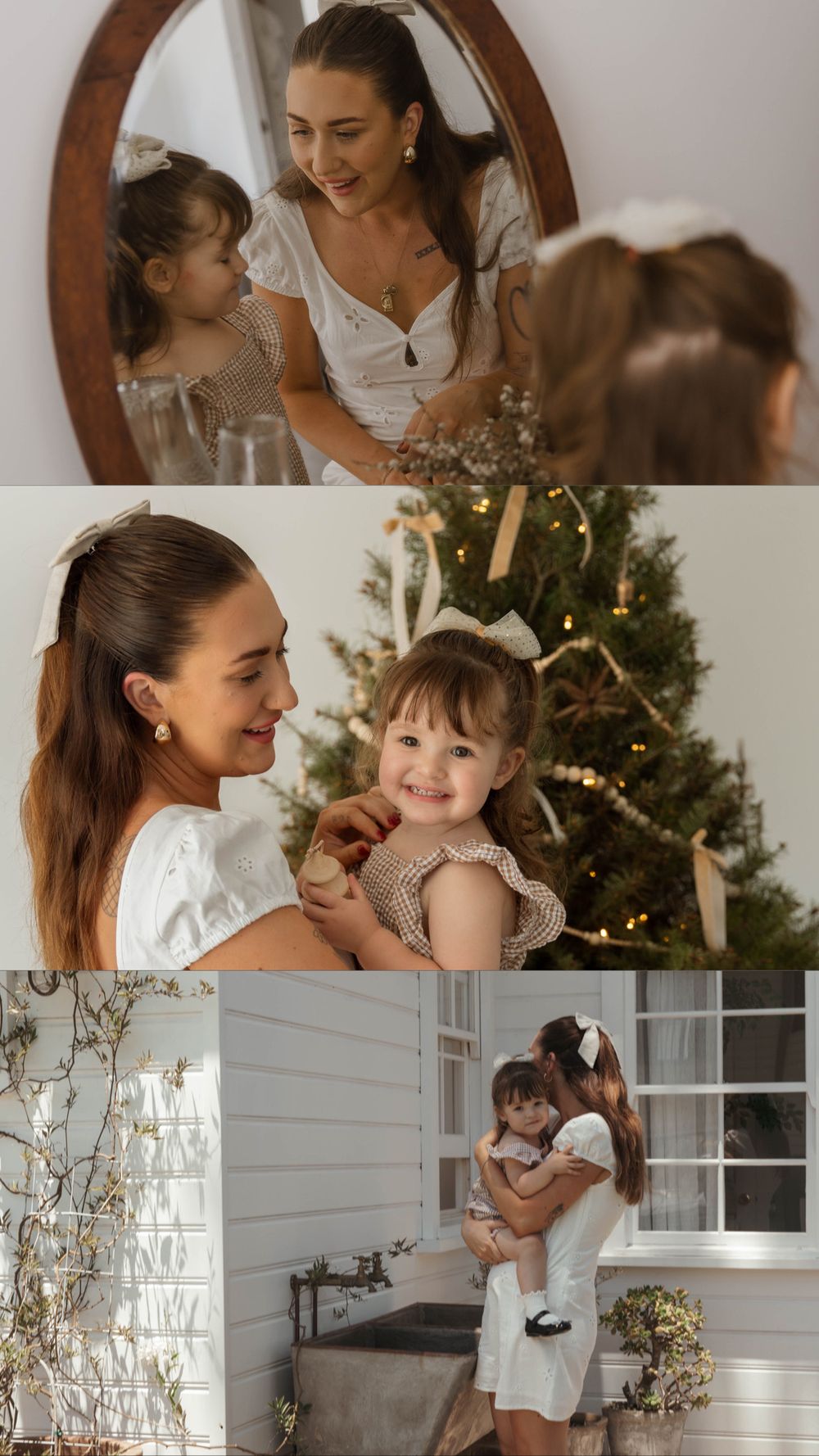 A mother and toddler daughter share sweet moments together near a Christmas tree in soft white holiday outfits.
