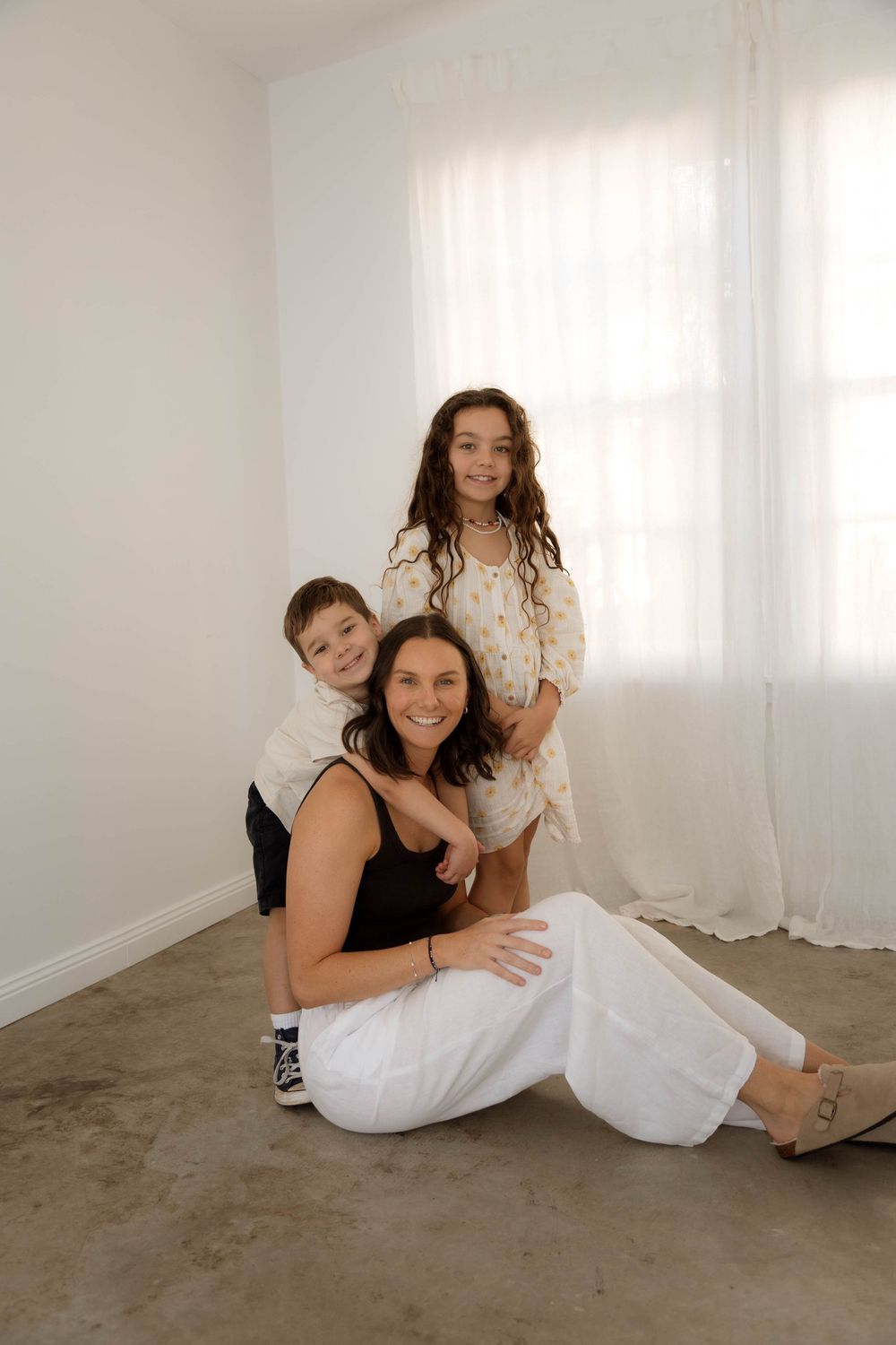 central coast maternity and family photography capturing natural, emotive motherhood moments in soft light.