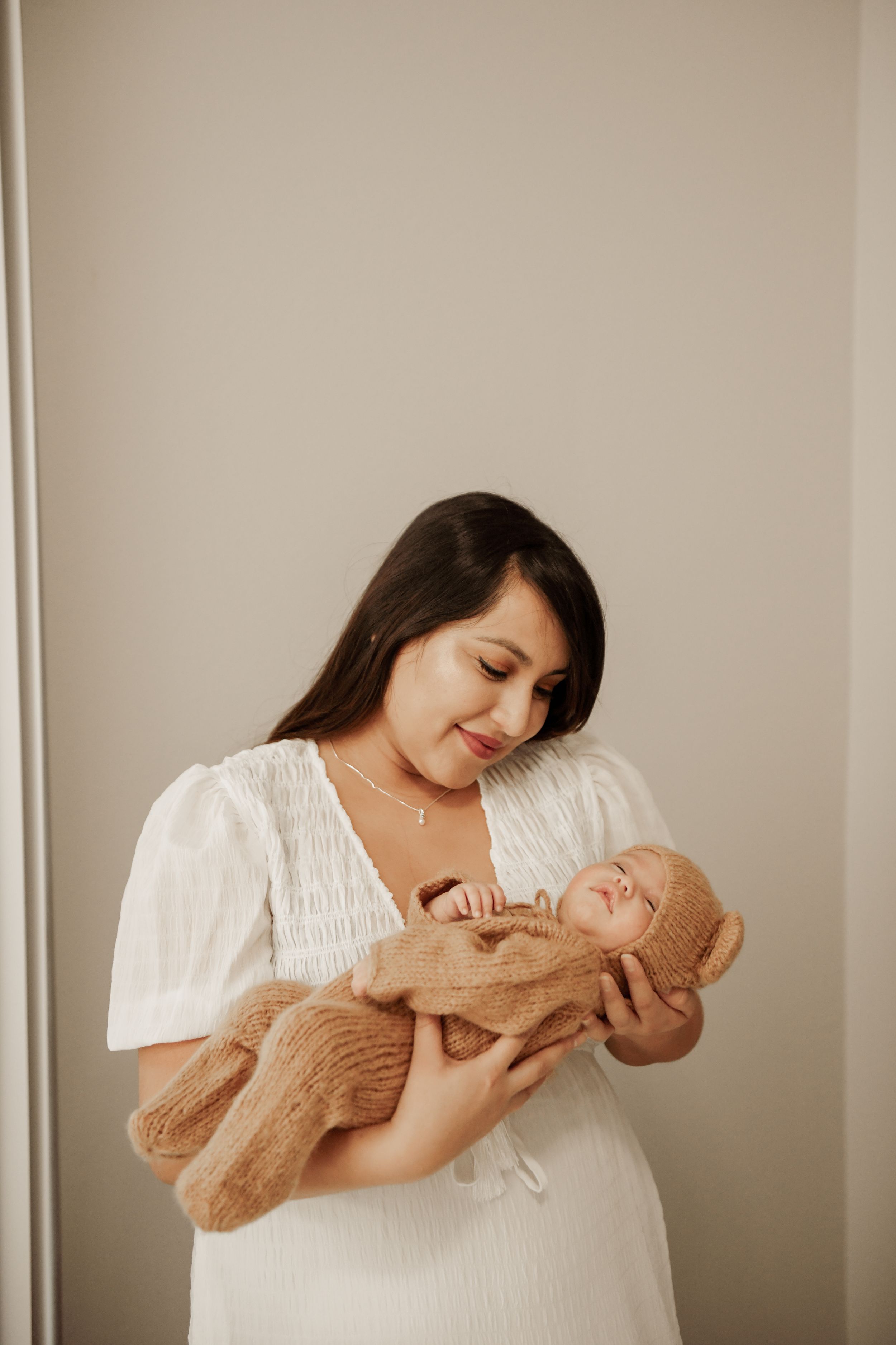 Colorado newborn photographer holding sleeping baby