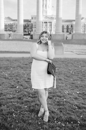 Series of black and white photos showing a person in a checkered dress posing on grass.