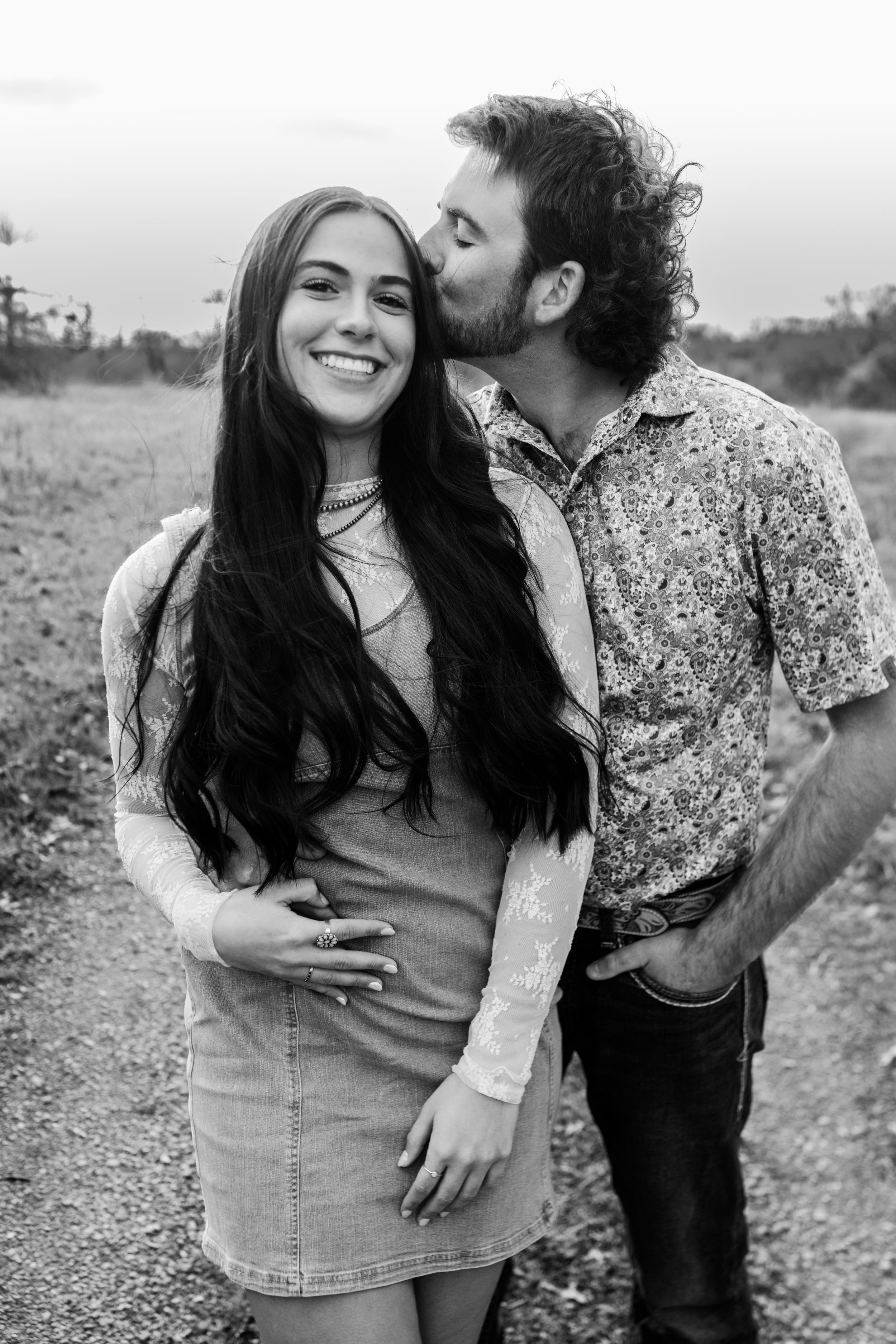 Couples photo session with western inspiration, featuring rustic styles and scenic outdoor backdrops for a unique and romantic vibe.