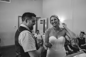 Black and white photo collage showing candid moments at a healthcare facility with staff and patients interacting.