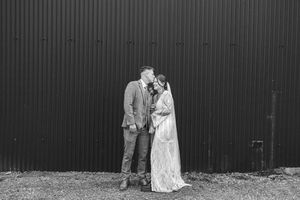 A black and white collage of wedding moments showing a couple embracing in various outdoor settings.