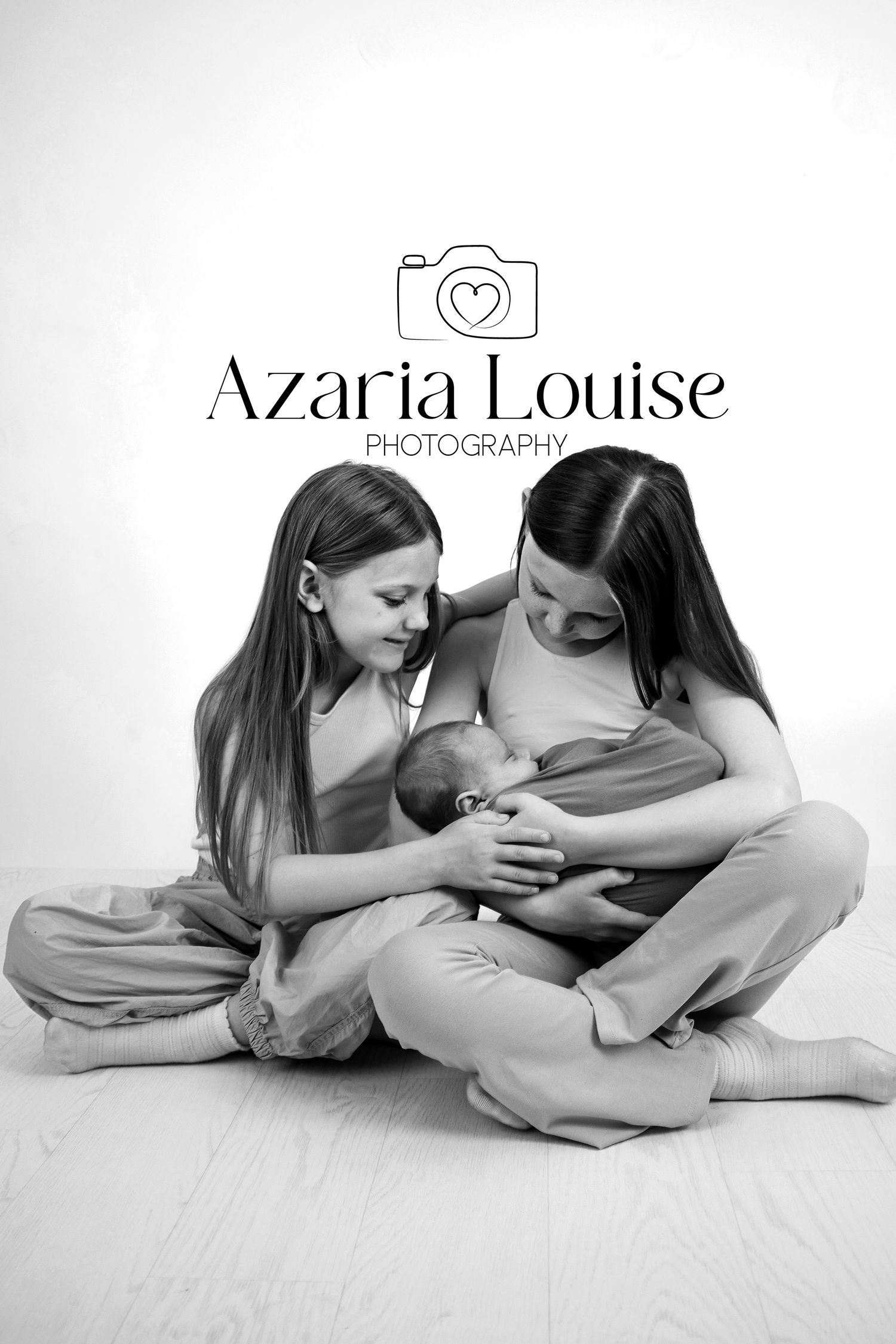 Black and white photography logo with camera heart icon and elegant typography showing studio brand name.