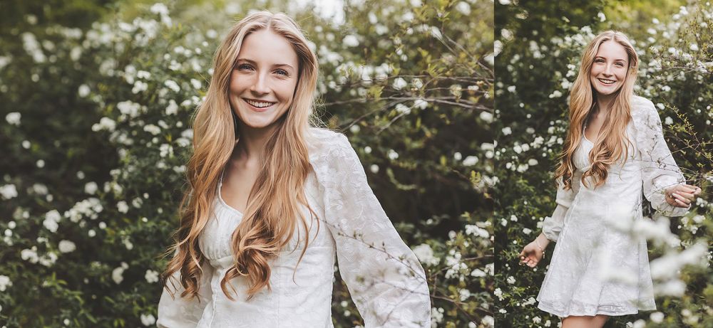 Outdoor portrait session in a garden with white spring flowers blooming.
