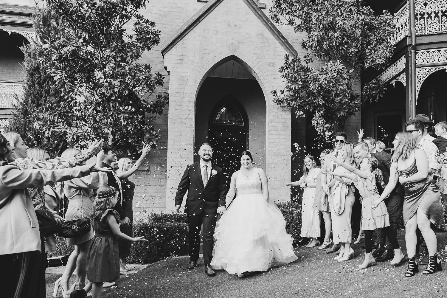 bride and groom leaving the chapel at The Convent Daylesford. Leigh Ball Documentary Wedding Photographer