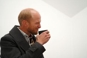 Close-up profile shots in a bright white setting show emotional expressions.