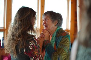 Group of workshop attendees sharing a moment during an indoor session.