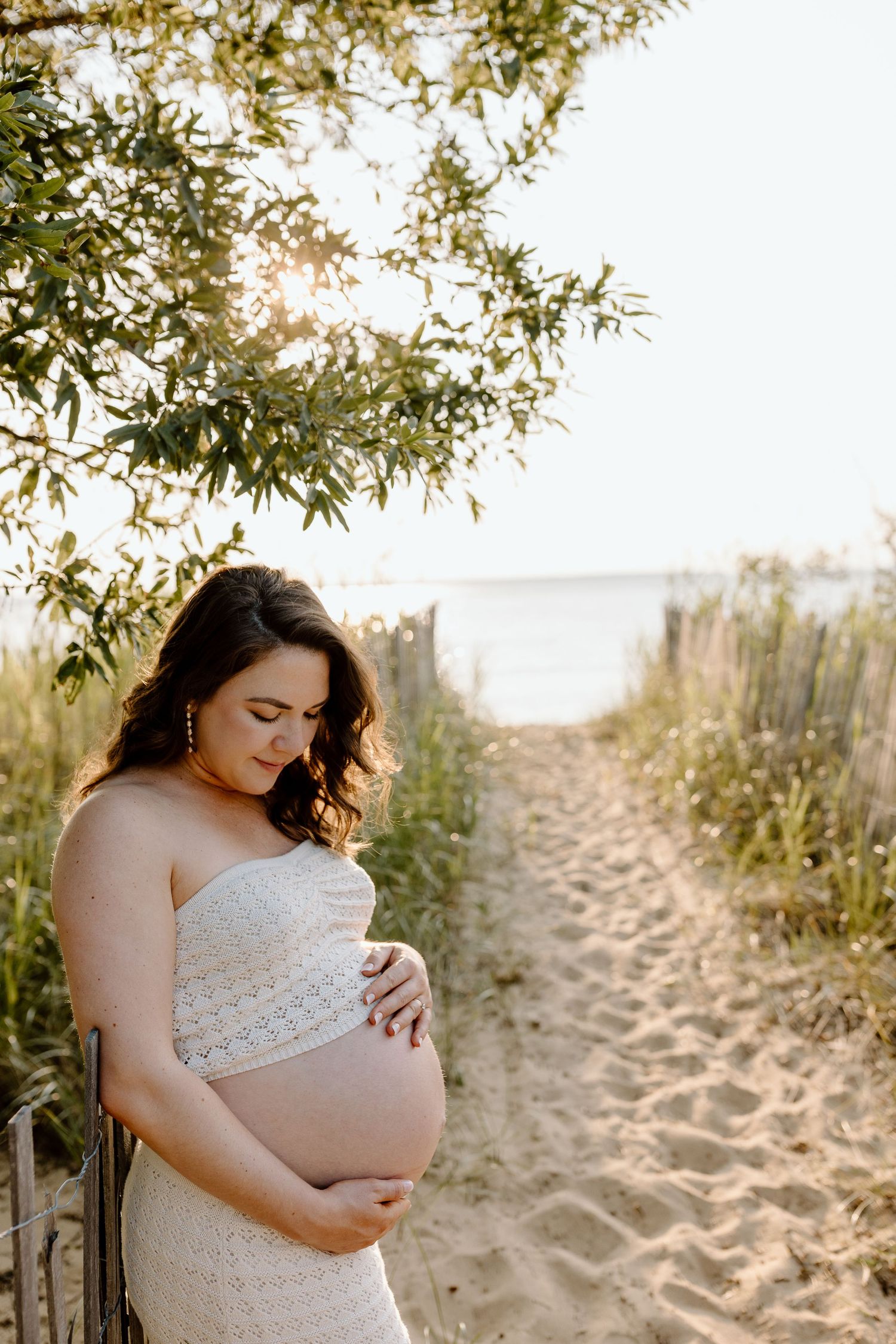 Casual beach photography session with relaxed poses on sandy shore.