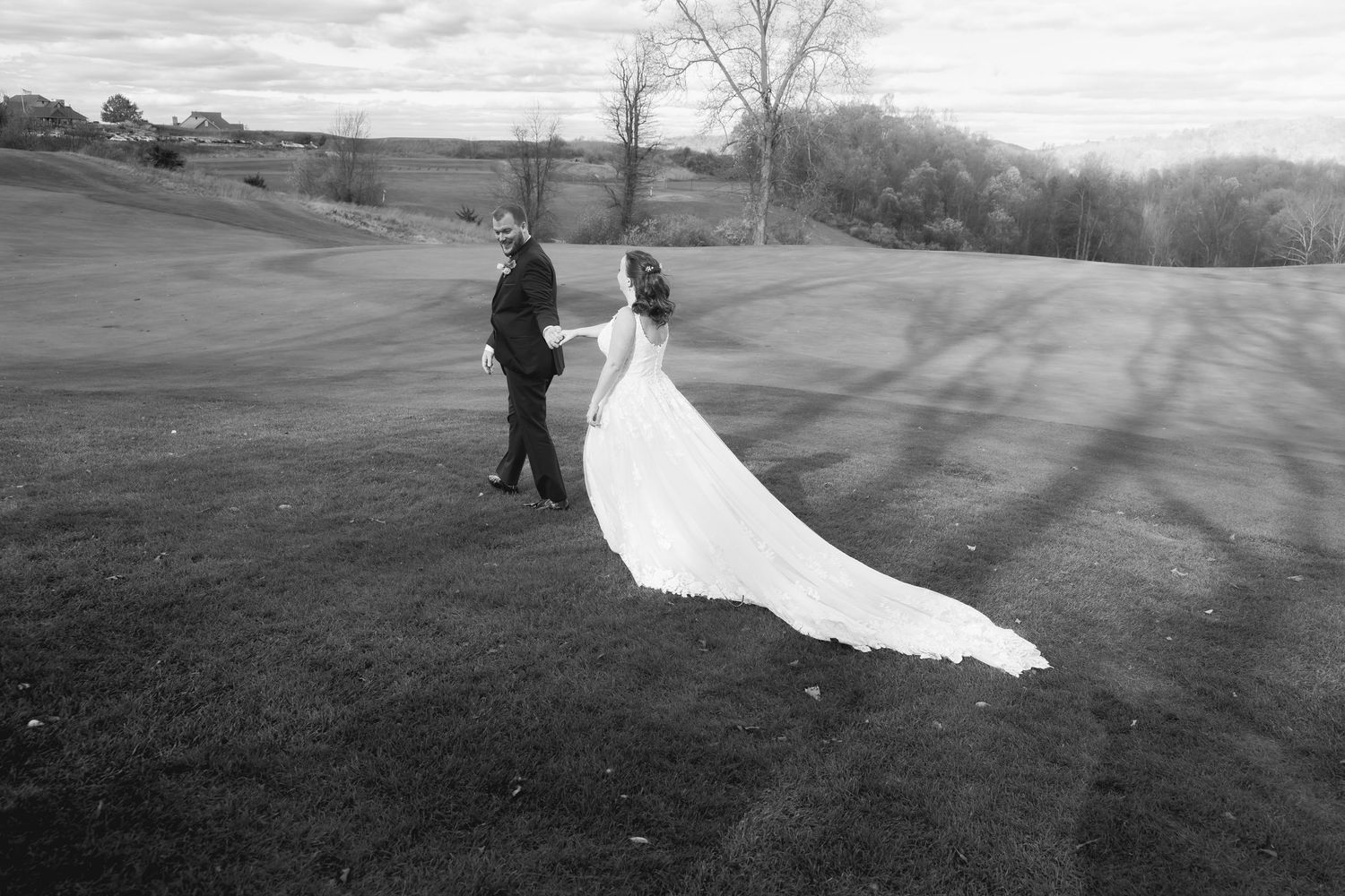 Dramatic black and white landscape photos with flowing wedding dress in motion.