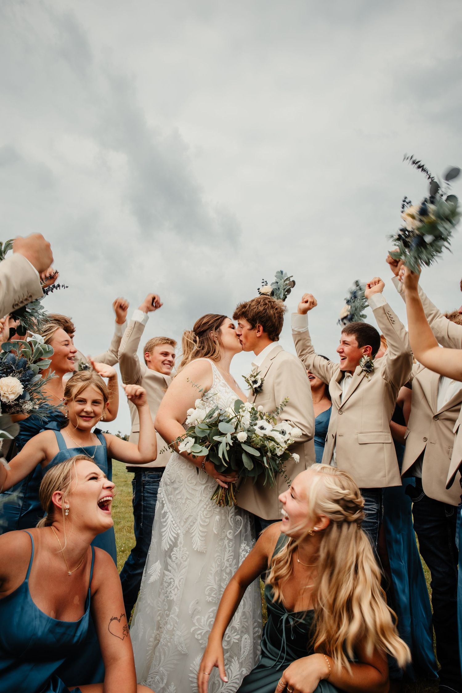 Northern MN Bride and Groom celebrate their wedding surrounded by Wedding Party
