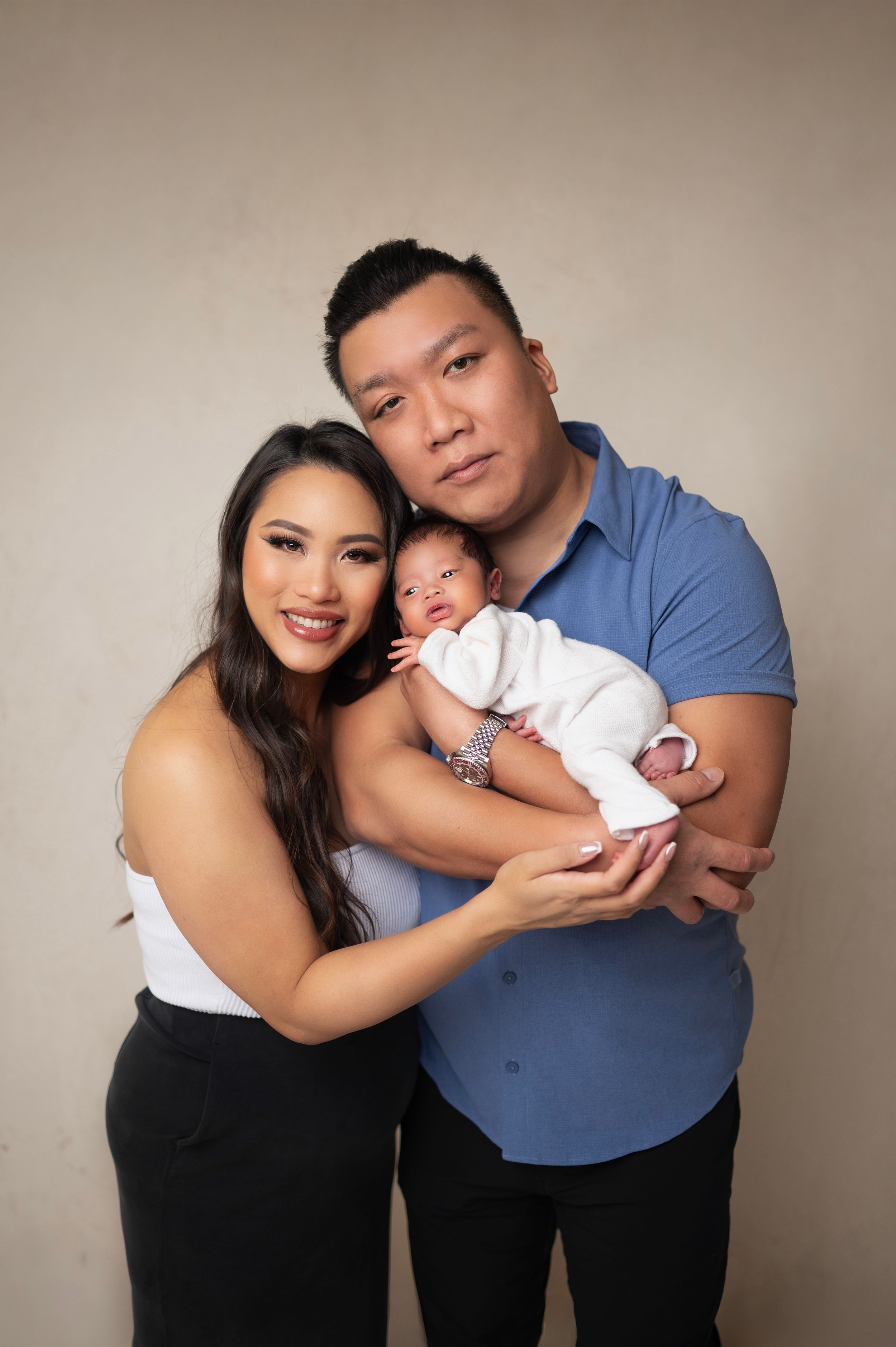 Newborn baby in knitted white outfit and parents photo session . Brooklyn NYC baby photography.