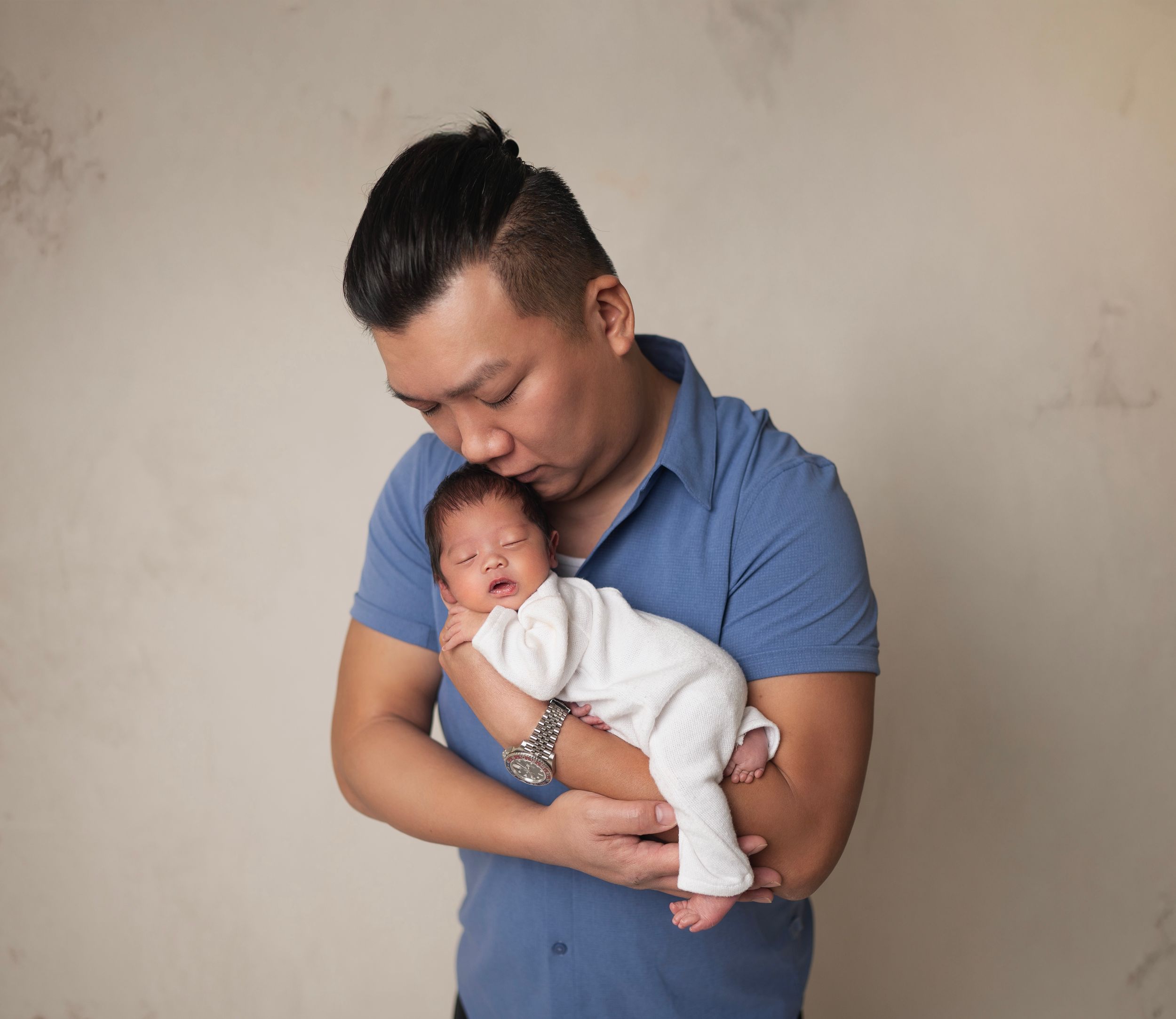 Newborn baby in knitted white outfit and dad photo session . Brooklyn NYC baby photography.