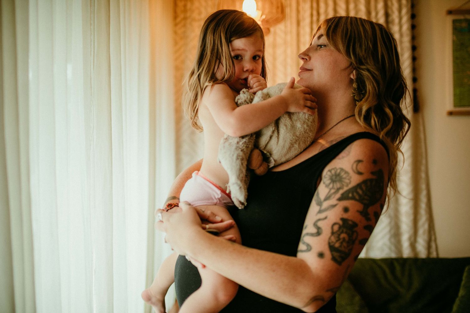 child is sucking thumb looking at camera portland oregon family photographer rushes & Waves