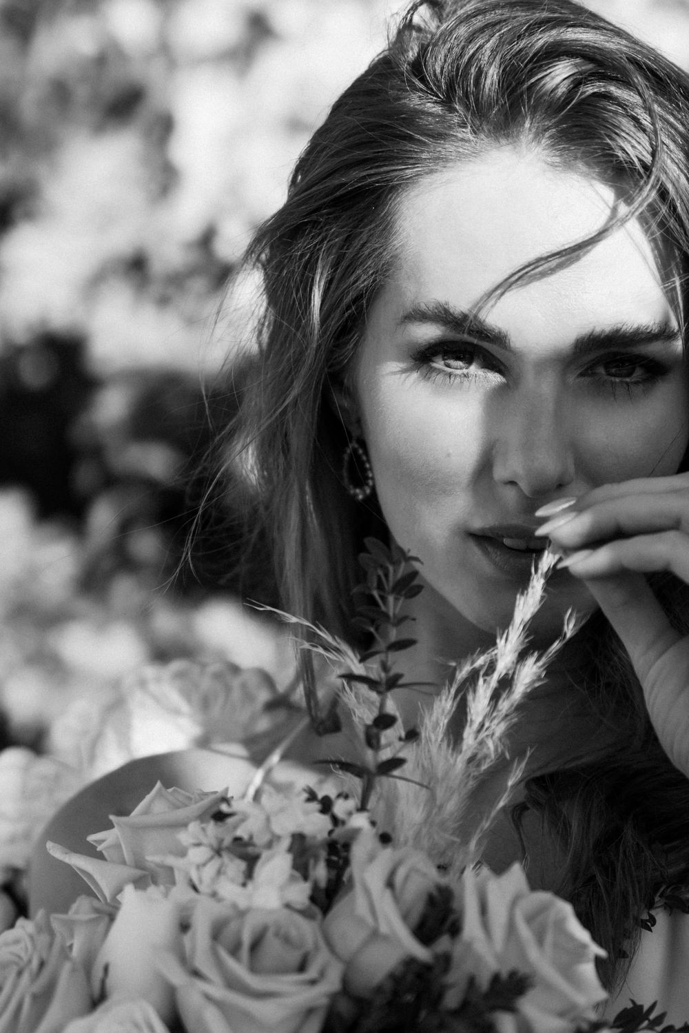 Artistic black and white portrait with roses.