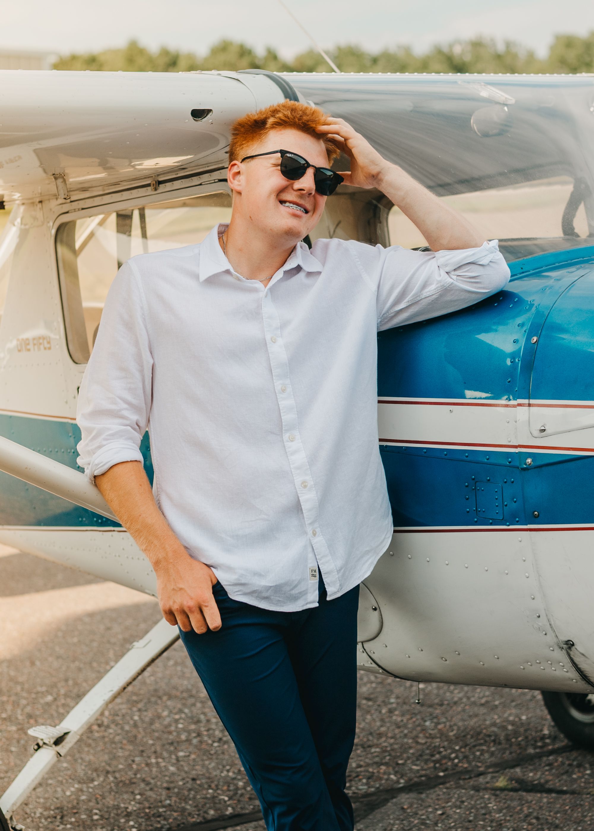Senior Grad Picture Portraits, Twin Ports area, Duluth and surrounding areas. Park Point senior photos, grad photos duluth MN, male airplane
