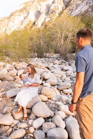 salt lake city utah family photographer, candid photo of a dad watching new mom with newborn