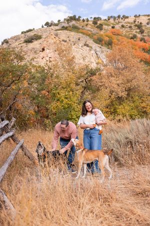 salt lake city utah family photographer, candid photo of a new family with dogs in mountains