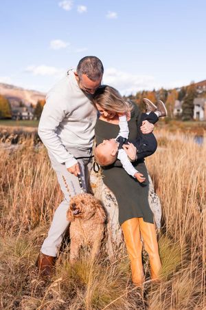 salt lake city utah family photographer, candid photo of a young family with dog in park city mountains