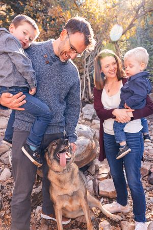 salt lake city utah family photographer, candid photo of a young family with dog in mountains