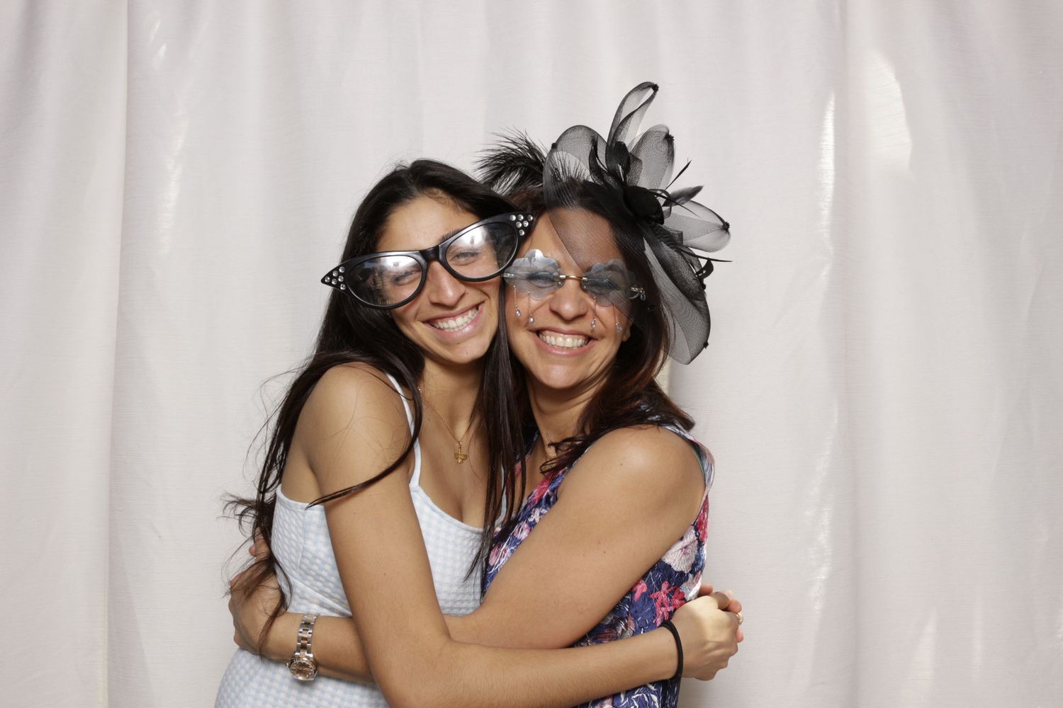 photobooth image of two women hugging