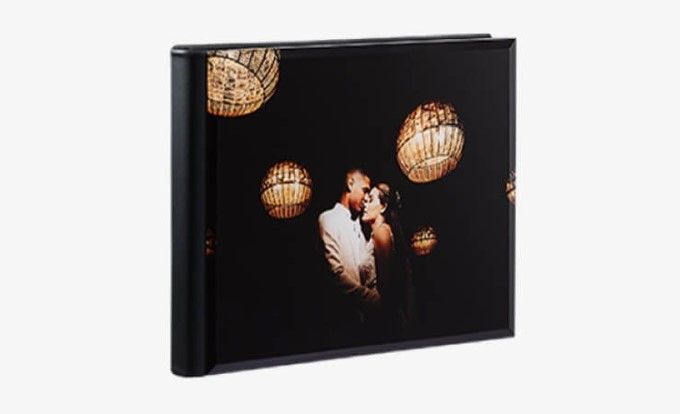 Stunning wedding album with a acrylic cover, featuring a newlywed couple's photo and wedding date