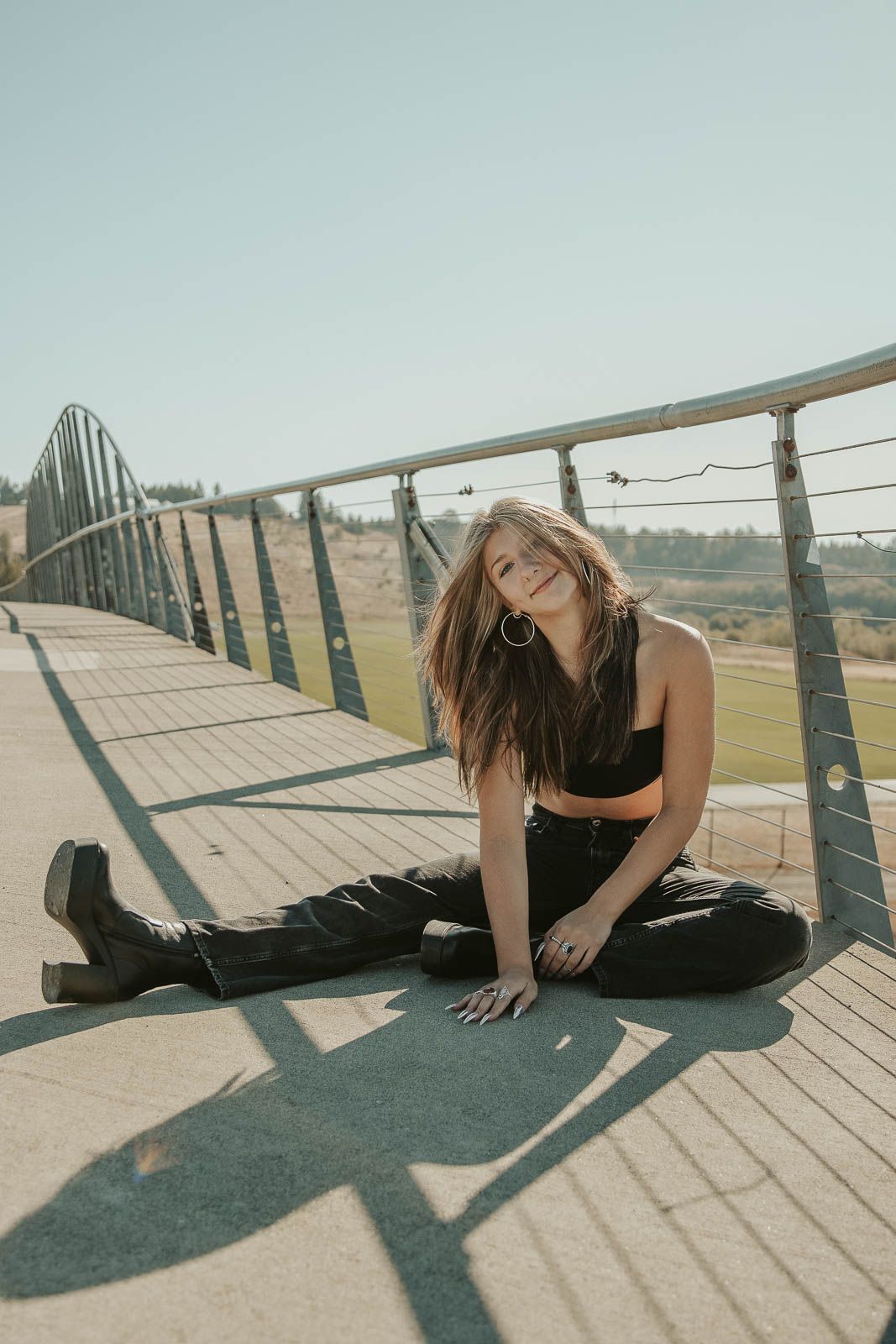 young-girl-senior-year-smiling-and-posing-by-herself-during-a-mini-session-in-spokane
