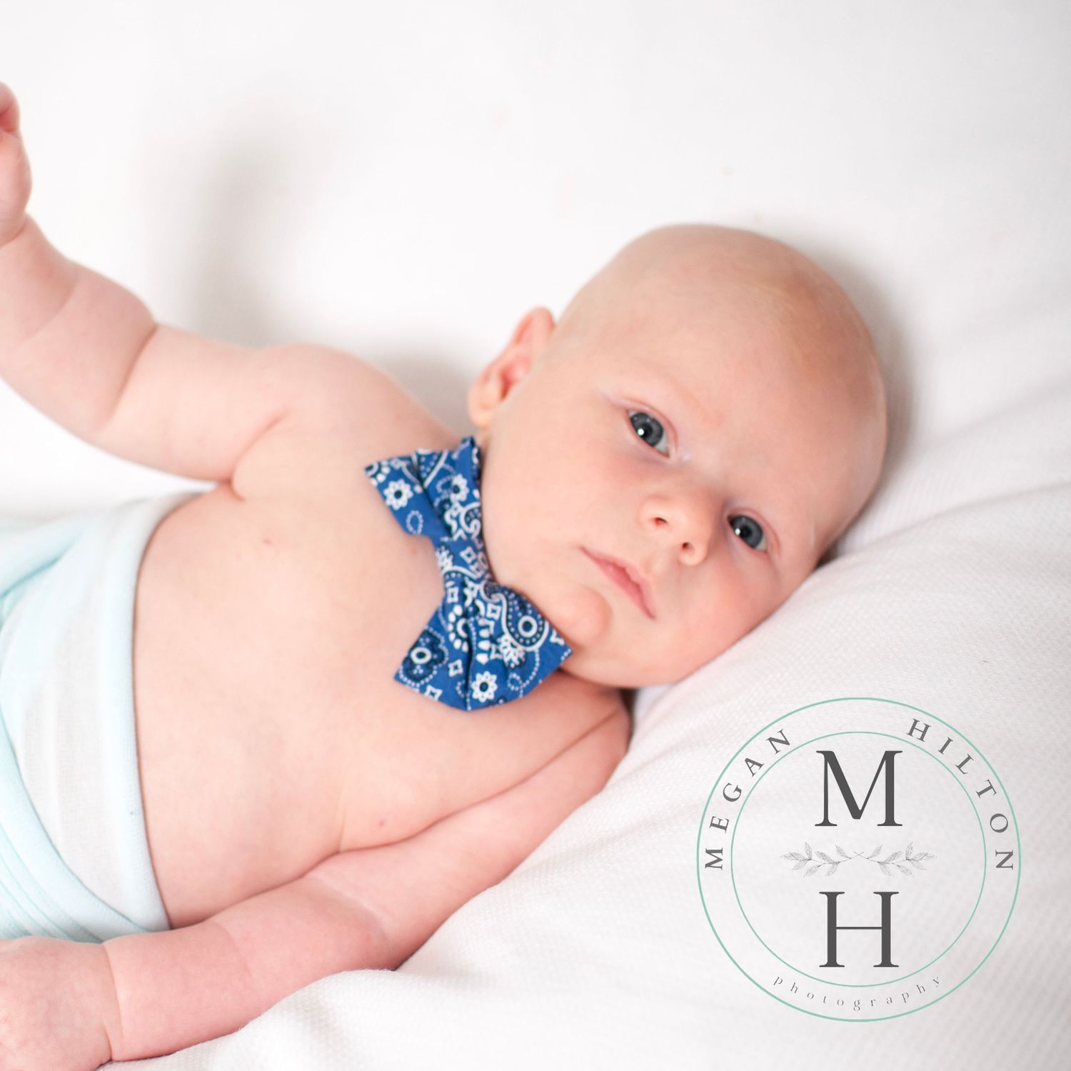 baby boy on white photo with blue bowtie