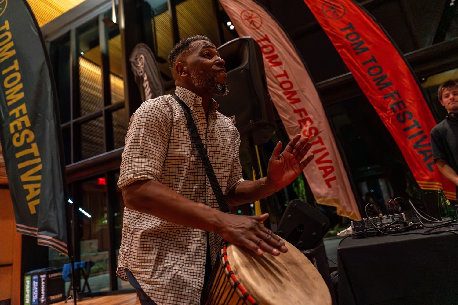 Drummer playing at a Charlottesville Tom Tom opening event at UVA