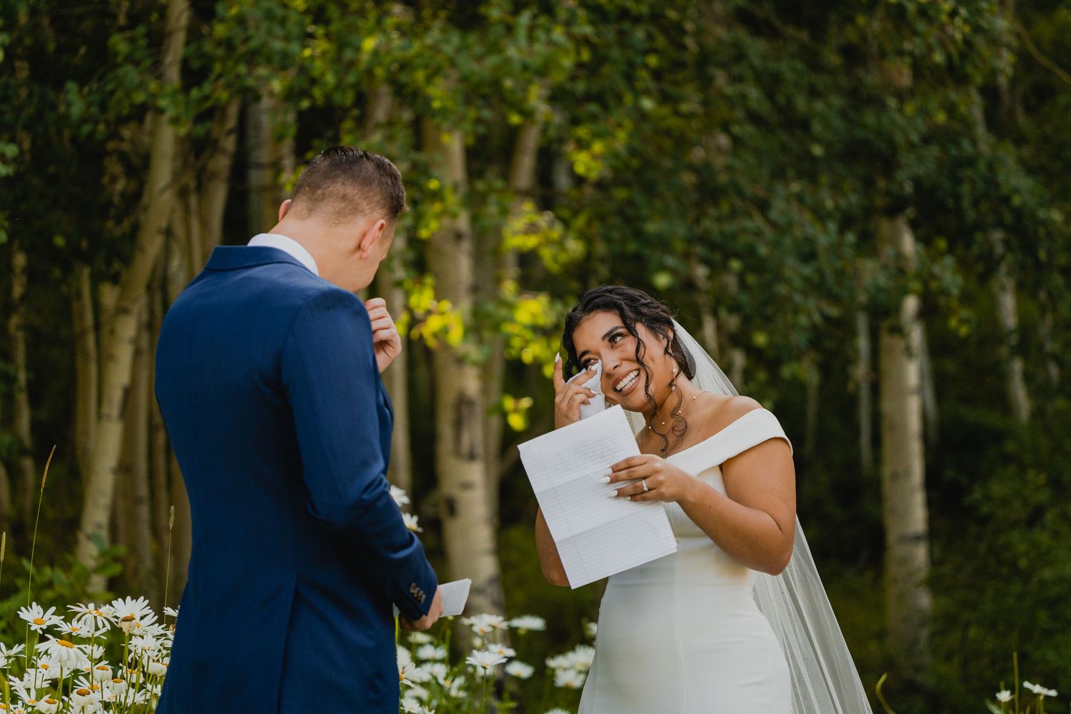 Bride crying while reading her vows