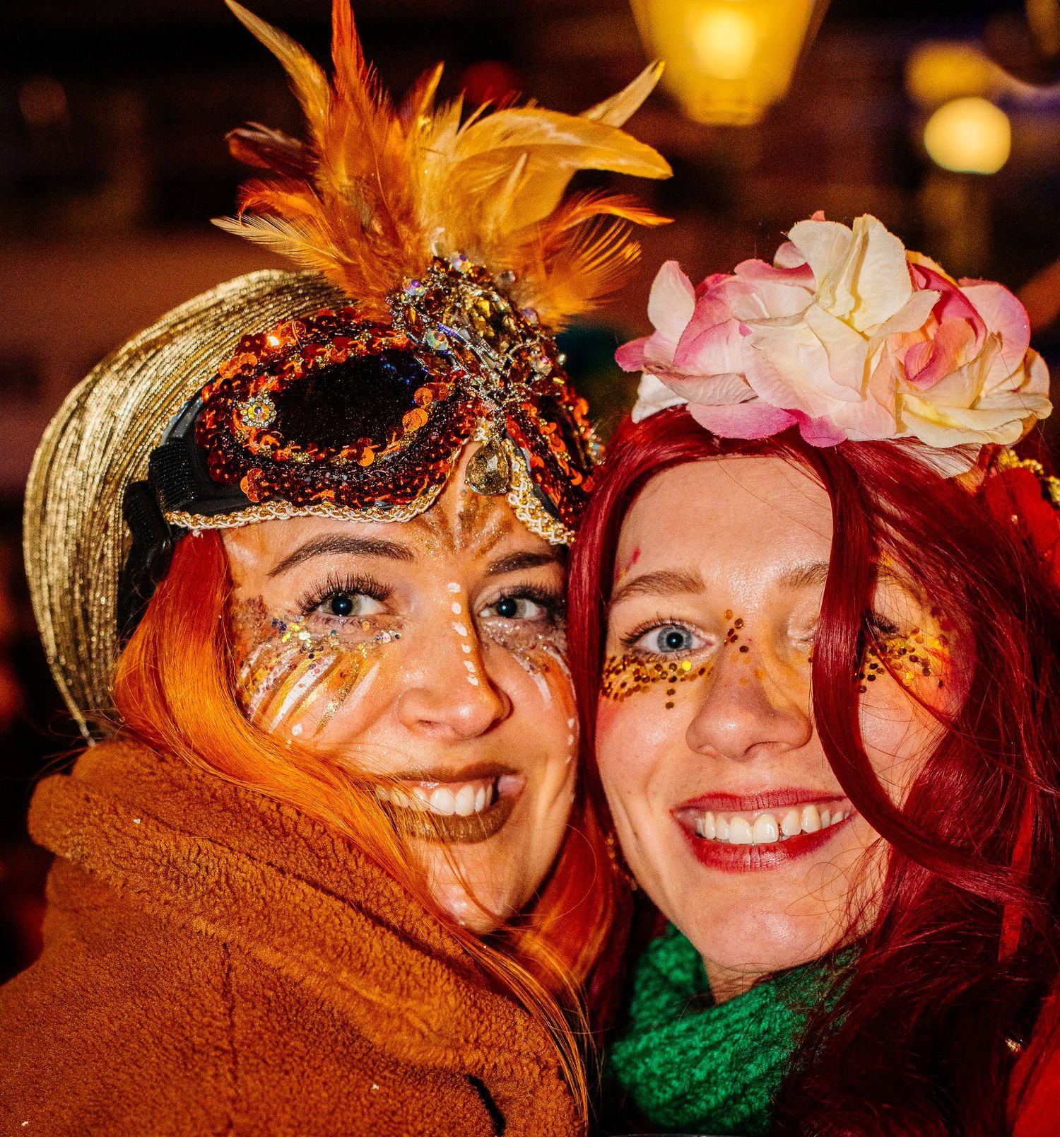 Close-up portrait of two women smiling and posing in costume at the Venlo Carnival.