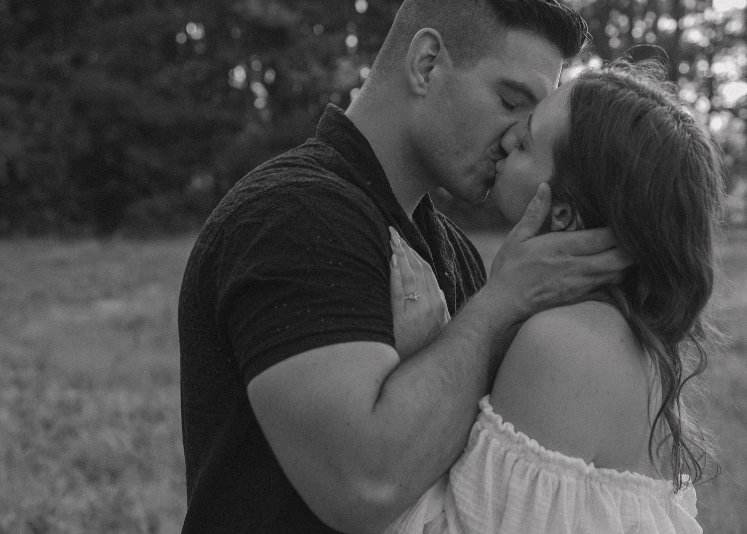 A romantic black and white portrait series of a couple sharing intimate moments.