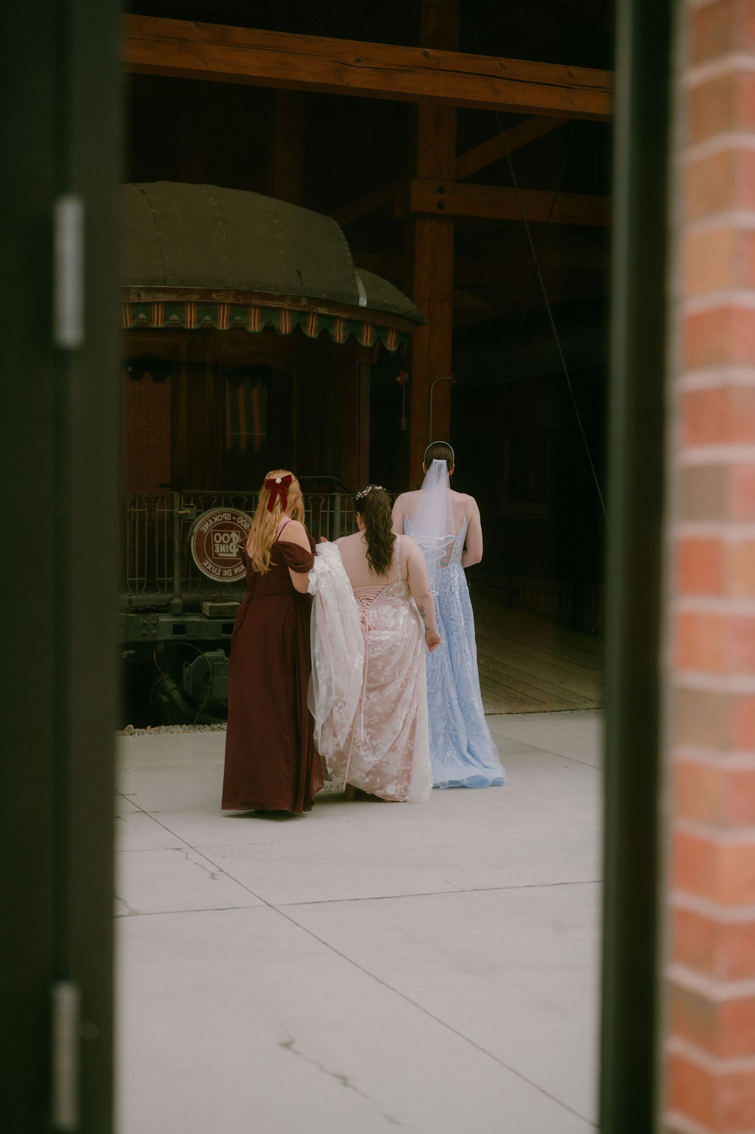 Romantic sunset moment on balcony with flowing wedding dress and autumn bouquet.